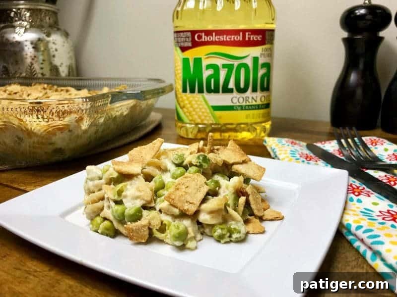 Guilt-Free Tuna Pasta Bake 2 A beautifully plated slice of the healthier tuna pasta casserole, showcasing its golden-brown topping and creamy texture.