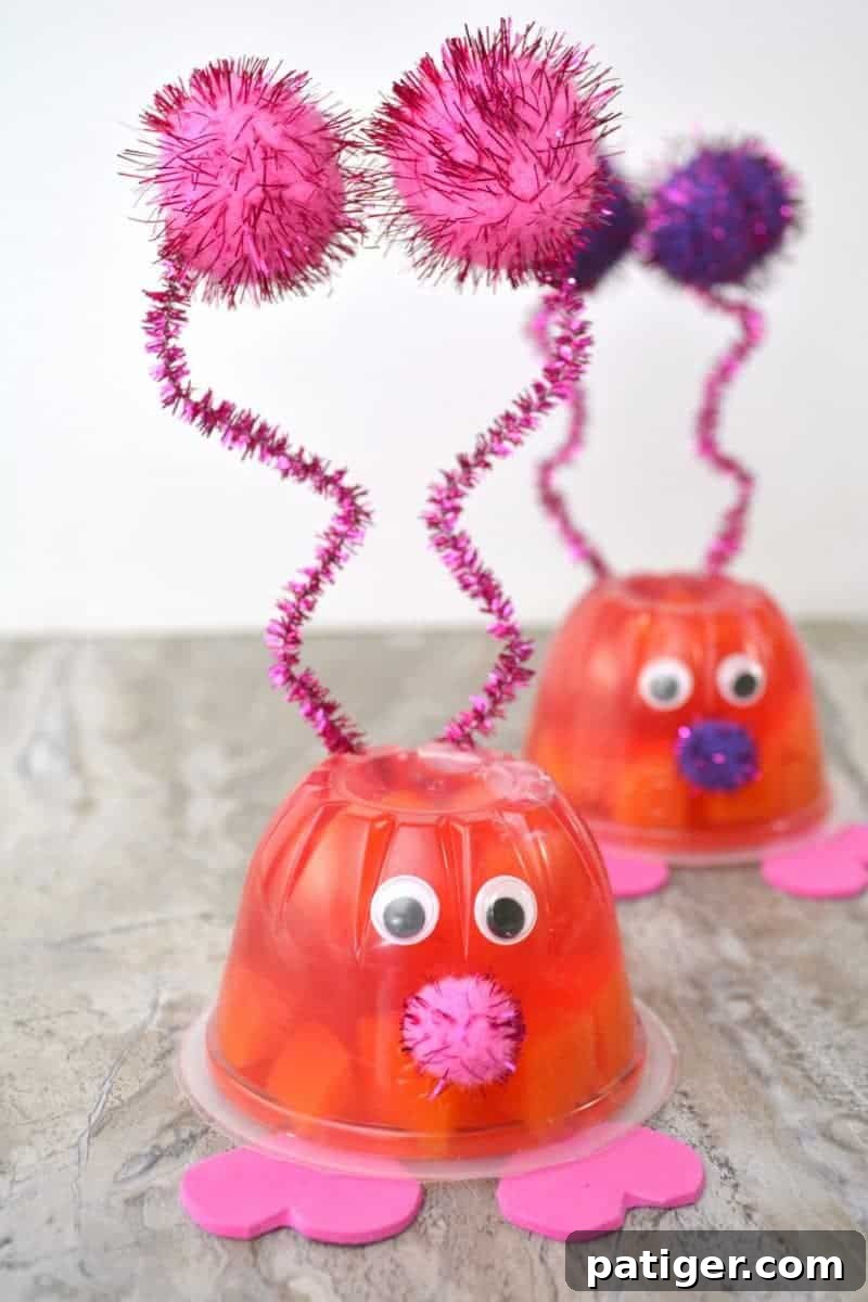 Fruity Love Bug Valentine Treats 3 Two Love Bug Valentine Fruit Cups, one with gelatin and one with fruit, ready for a party.