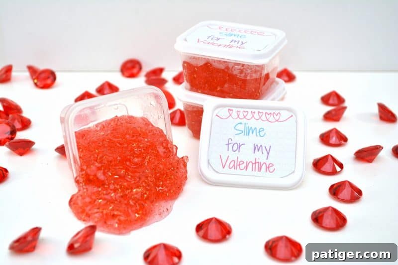 Sweetheart Slime Creation and Complimentary Gift Tags 2 Kids holding clear containers of sparkling red Valentine slime with custom labels