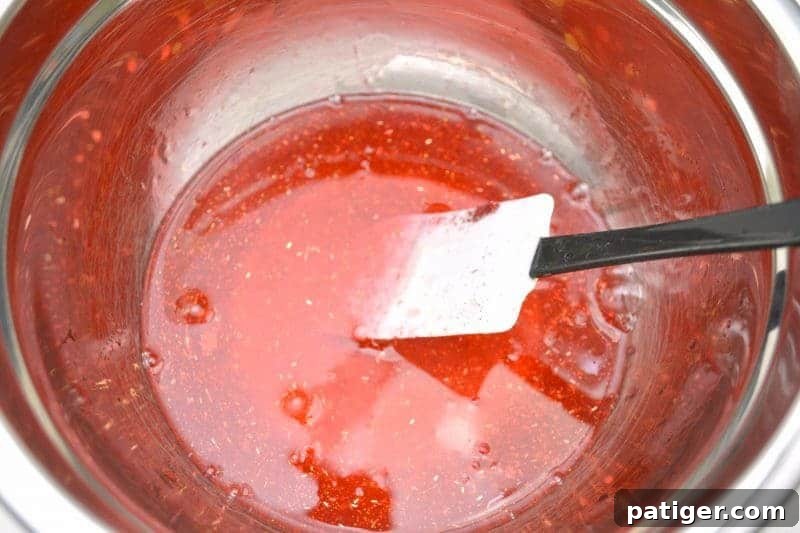 Sweetheart Slime Creation and Complimentary Gift Tags 4 Mixing red glitter glue with warm water in a bowl for Valentine slime