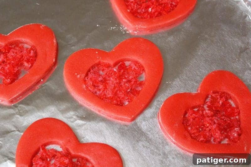 Step-by-step image of filling cookies with crushed candy