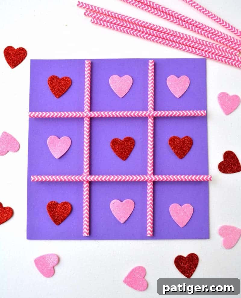 XOXO Tic Tac Toe 2 Completed DIY Valentine's Day Tic Tac Toe game board with pink and red heart pieces