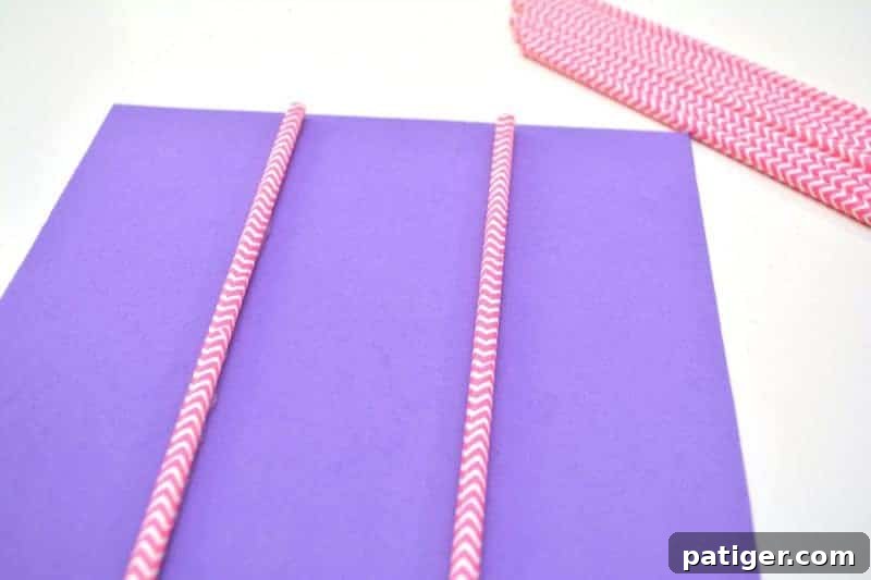 XOXO Tic Tac Toe 6 Attaching the first two paper straws for the horizontal lines of the Tic Tac Toe grid