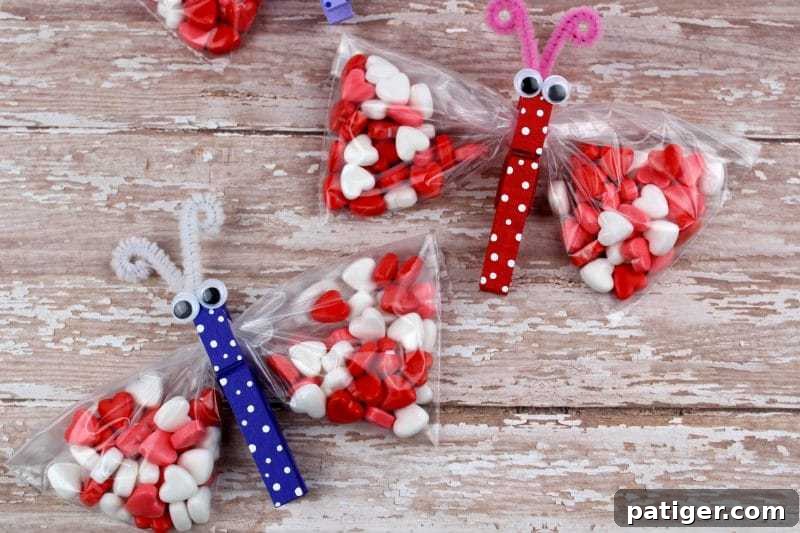 Close-up of a finished butterfly treat bag featuring heart-shaped candies for Valentine's Day