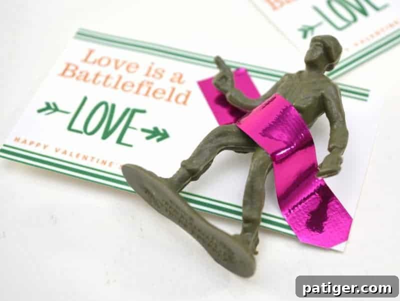 Heartwarming Heroics Free Printable Valentines for Kids 4 A finished 'Love is a Battlefield' toy soldier Valentine with washi tape, ready to be gifted.