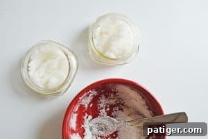 Sugar scrub spooned into small glass jars