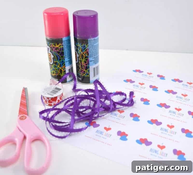 Materials for making Silly String Valentines including cans, ribbon, scissors, and hole punch