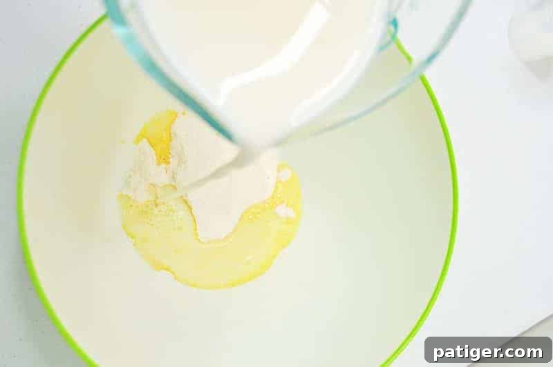 Magically Delicious St Patricks Day Pudding Parfaits 5 Mixing vanilla pudding mix with cold milk in a bowl