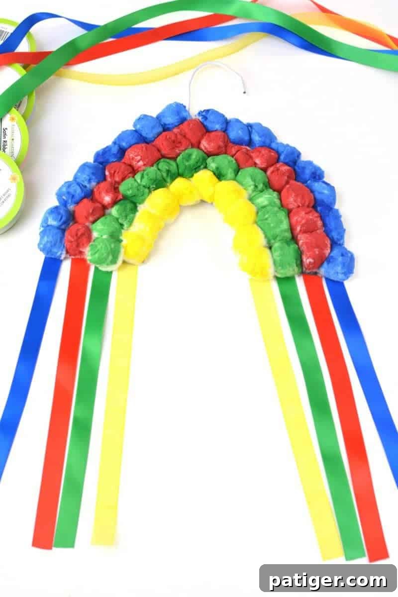 Vibrant Hanging Cotton Ball Rainbow Craft for St. Patrick's Day or Spring