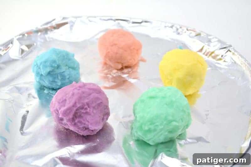 Enchanted Rainbow Stones: A Hidden Fortune 11 A tray filled with freshly molded, colorful magic rainbow rocks, ready for freezing.