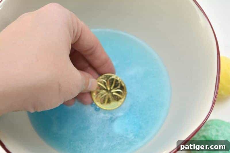 Enchanted Rainbow Stones: A Hidden Fortune 5 A collection of colorful magic rocks, some partially dissolved to reveal small golden coins and other tiny toys.