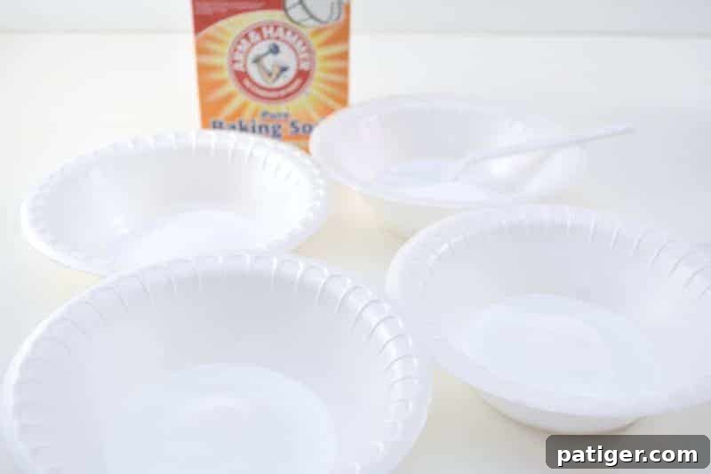 Enchanted Rainbow Stones: A Hidden Fortune 7 A hand measuring baking soda into a bowl using a plastic spoon, beginning the magic rock creation process.