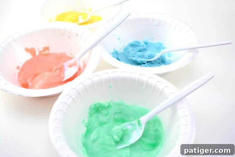 Enchanted Rainbow Stones: A Hidden Fortune 9 Mixing vibrant food coloring into the baking soda and water mixture in a bowl to create a colorful paste.