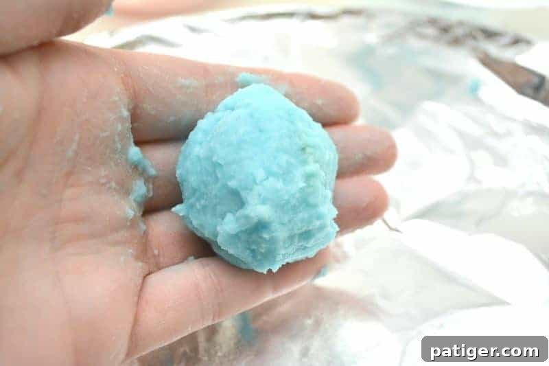 Enchanted Rainbow Stones: A Hidden Fortune 10 Hands carefully pressing baking soda mixture around a gold coin to form a hidden treasure rock.