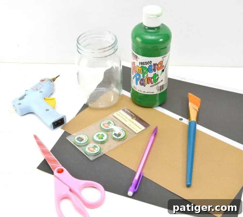Materials for Leprechaun Mason Jar Craft including paint, glitter cardstock, and ribbon