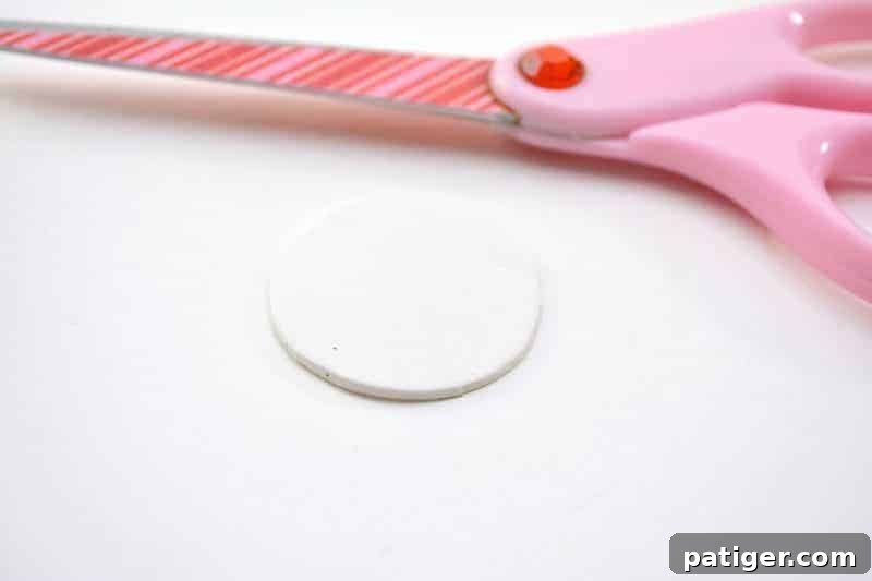 Craft a Lucky Leprechaun from Popsicle Sticks for St Patricks Day 5 Step 1: Cutting a perfectly round circle from white craft foam, which will form the base for the leprechaun's head.