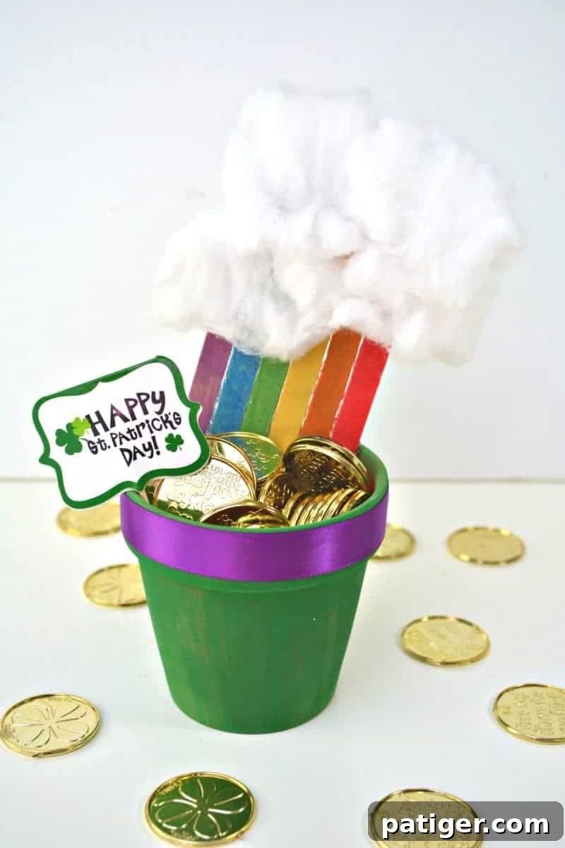 St Patricks Day Lucky Rainbow Gold Planter 2 A beautifully crafted DIY St. Patrick's Day decoration: a rainbow made of popsicle sticks arching into a green terra cotta pot filled with gold coins and topped with fluffy clouds.