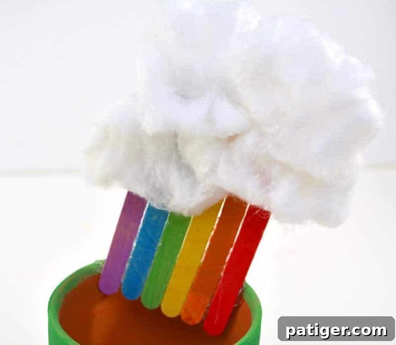 St Patricks Day Lucky Rainbow Gold Planter 9 Fluffy cotton balls glued to the top of the rainbow popsicle sticks inside the pot, forming a puffy cloud.