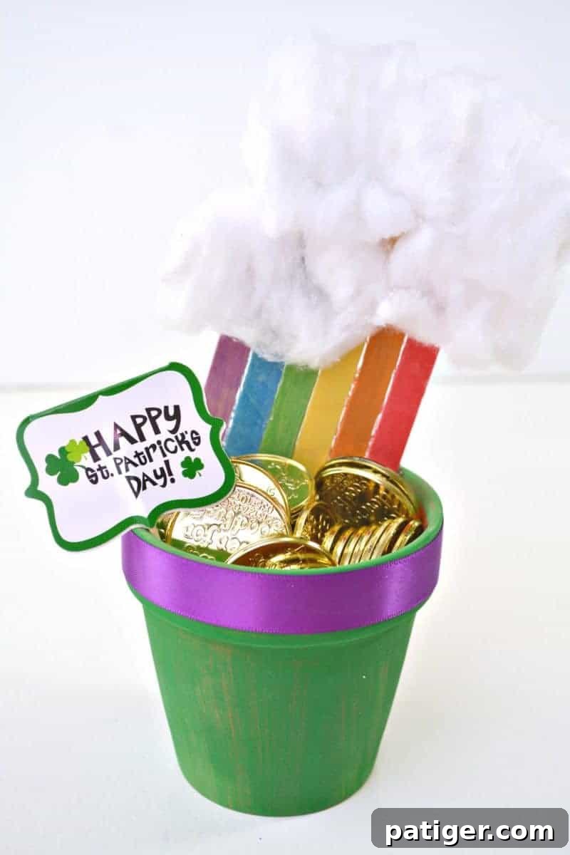 St Patricks Day Lucky Rainbow Gold Planter 11 A finished DIY Rainbow Pot of Gold Planter filled with plastic gold coins, ready for display.