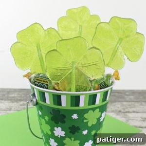 Beautiful green shamrock lollipops, an easy St. Patrick's Day treat.