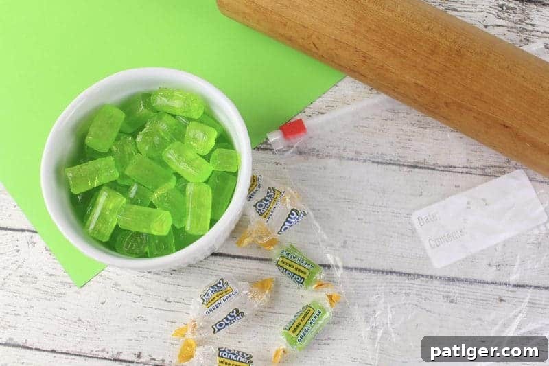 Lucky Shamrock Pops for St Patricks Day 5 Step one of making Jolly Rancher shamrock lollipops: unwrapping the candies.