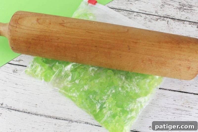 Lucky Shamrock Pops for St Patricks Day 6 Step two of making Jolly Rancher shamrock lollipops: crushing the hard candies.