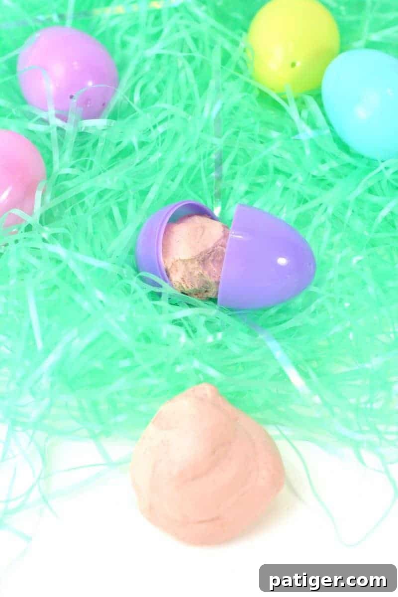 Vibrant edible silly putty made with gummy worms, offering a safe and engaging sensory play experience for children.