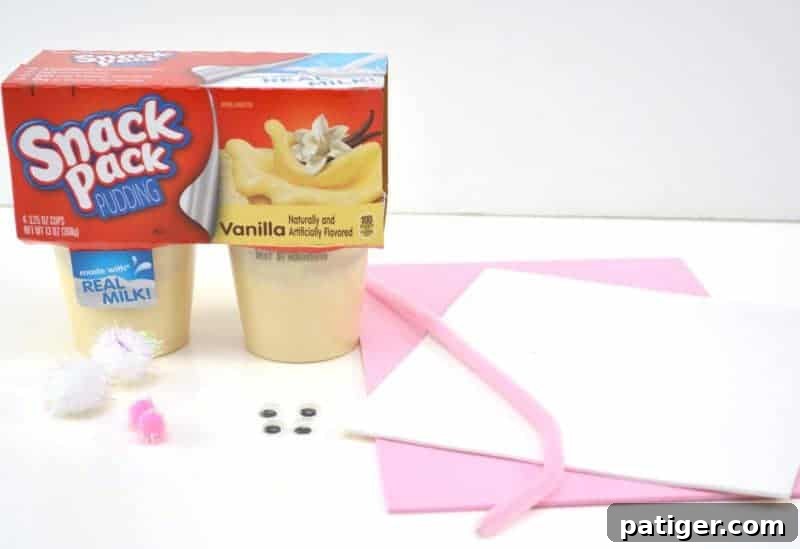 A vibrant collection of craft materials, including colorful foam, googly eyes, and pom poms, neatly arranged and ready to be transformed into an Easter Bunny Pudding Cup.