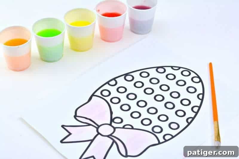 Looking for a fun Easter kids activity?! How about making 2-ingredient watercolor paint with Skittles candies?! See how to make skittles paints and download a free printable Easter egg coloring page.