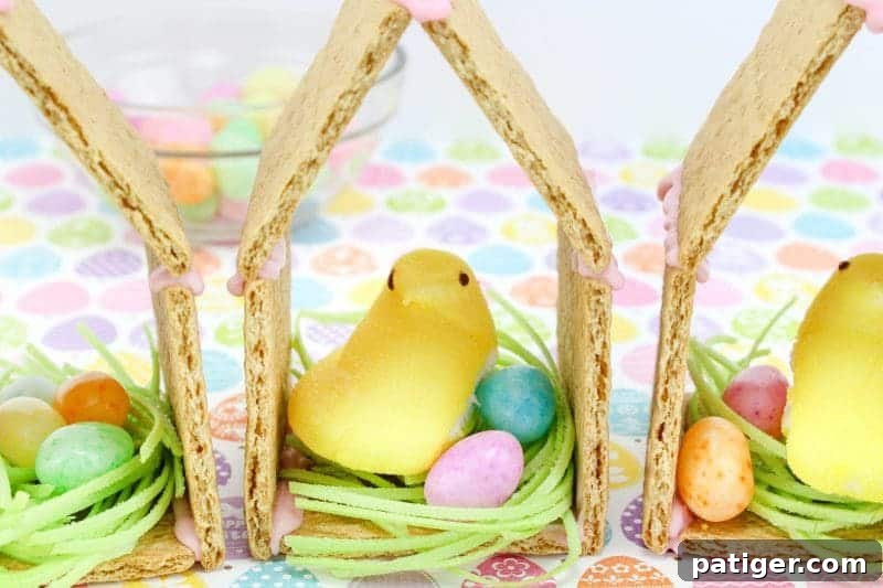 Peeps chicks houses are a fun no bake Easter treat perfect for the kids this Spring season. Made using Peeps Chicks, graham crackers, egg candies, and edible grass, this cute Easter recipe is perfect to make with the little ones.