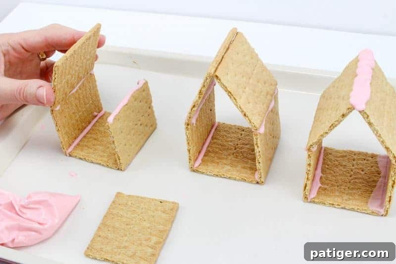 Peeps chicks houses are a fun no bake Easter treat perfect for the kids this Spring season. Made using Peeps Chicks, graham crackers, egg candies, and edible grass, this cute Easter recipe is perfect to make with the little ones.