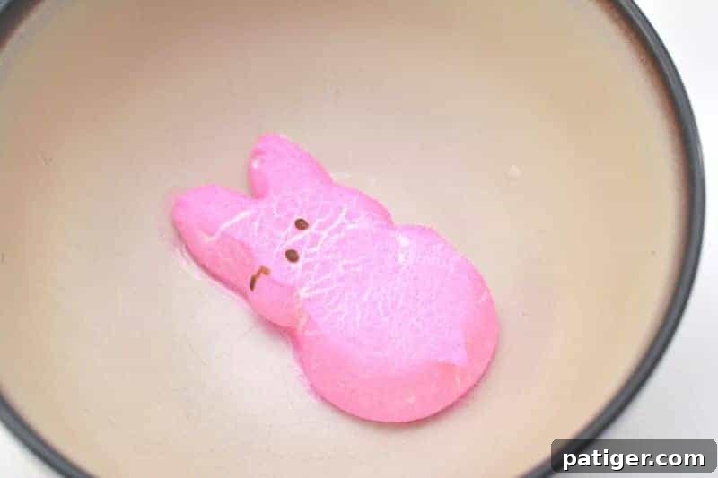 Marshmallow Peep expanding in a microwave-safe bowl, a key step in making homemade puffy paint.