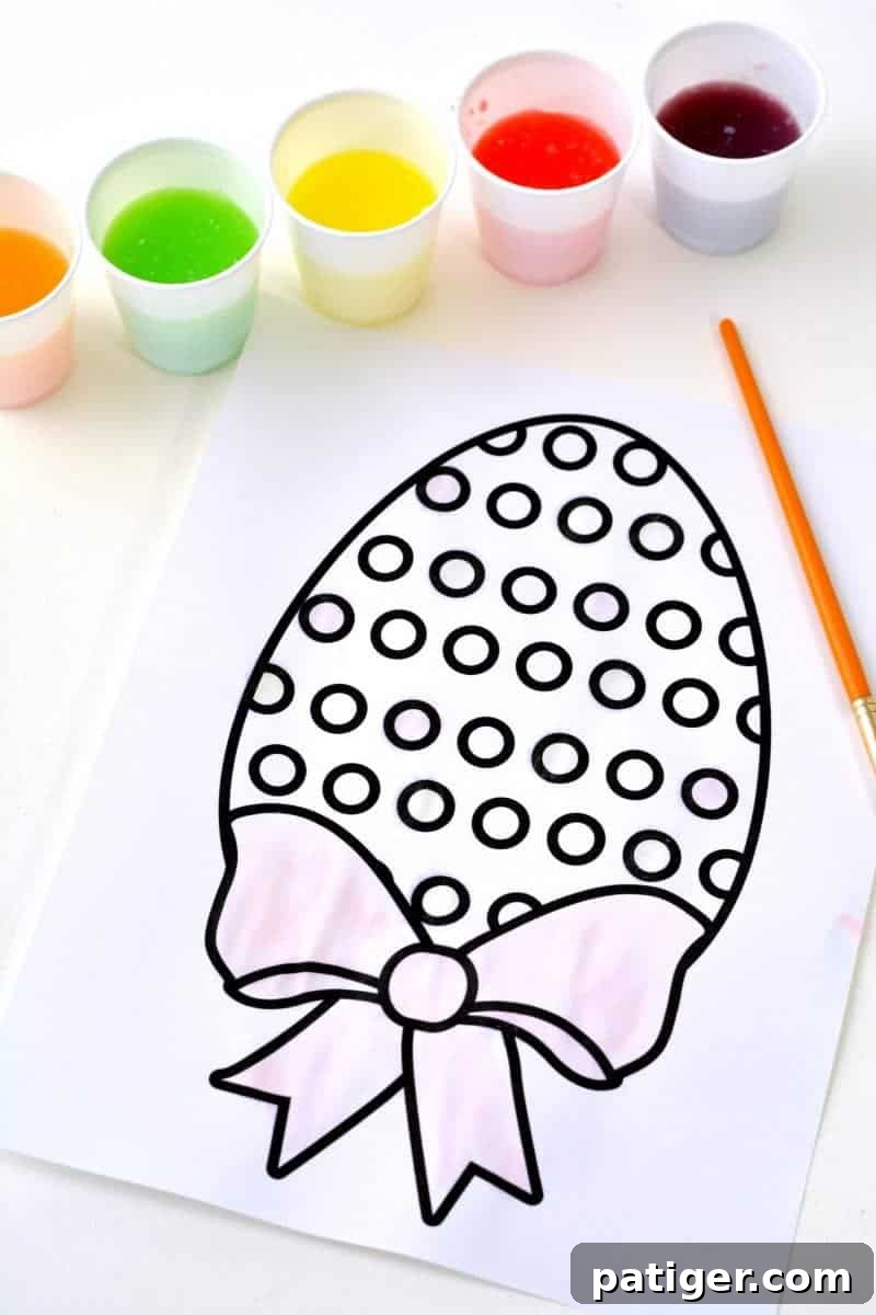 Fun Easter kids activity: learn how to make 2-ingredient watercolor paint with Skittles candies and download a free printable Easter egg coloring page.