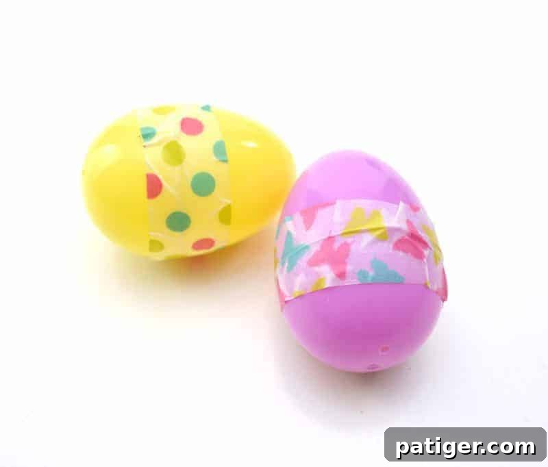 A plastic Easter egg sealed with colorful washi tape, a crucial step for a secure maraca.