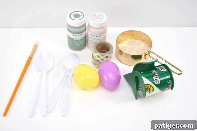 A collection of supplies needed to make Easter egg maracas: washi tape, plastic eggs, plastic spoons, and small fillers like rice and beans.