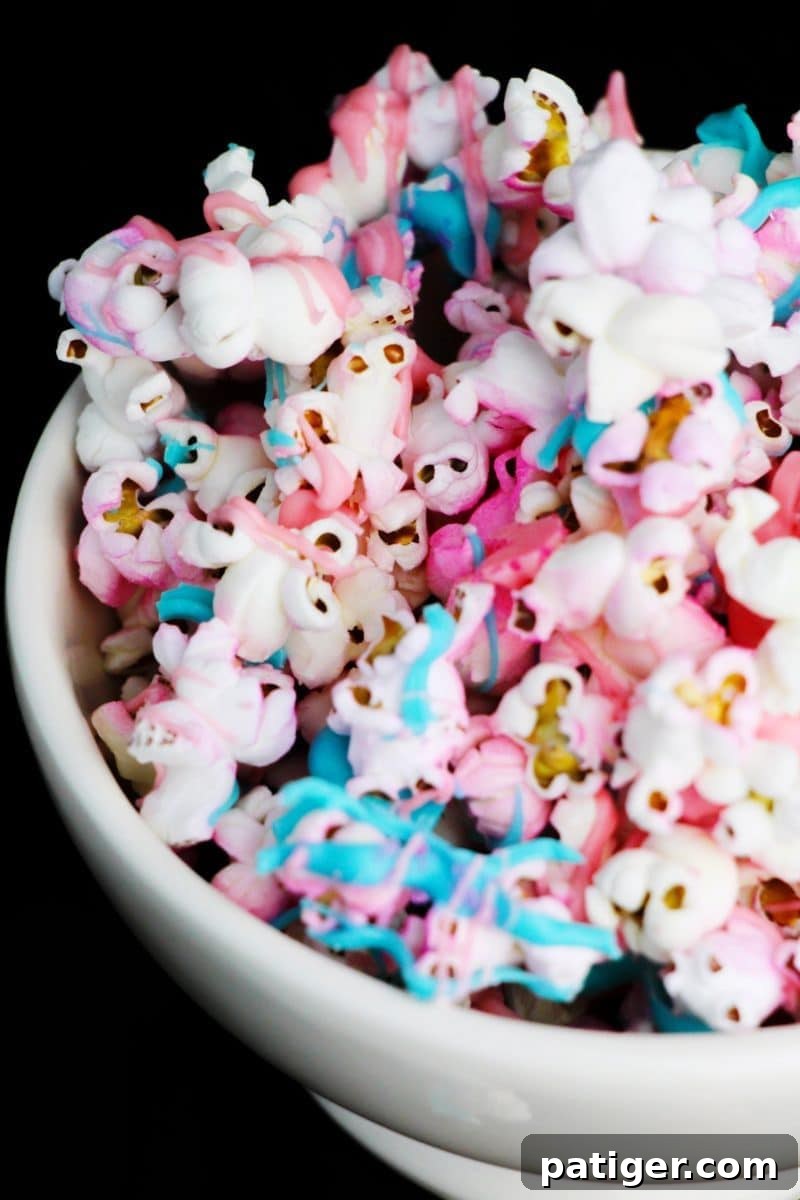 A close-up of colorful unicorn popcorn, ideal for a unicorn-themed snack table.