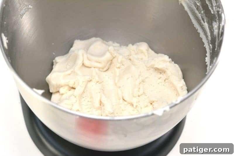 Pink Princess Sweet Dough Magic 6 Crumbly mixture of cake mix and icing in a mixing bowl, ready for the next step.