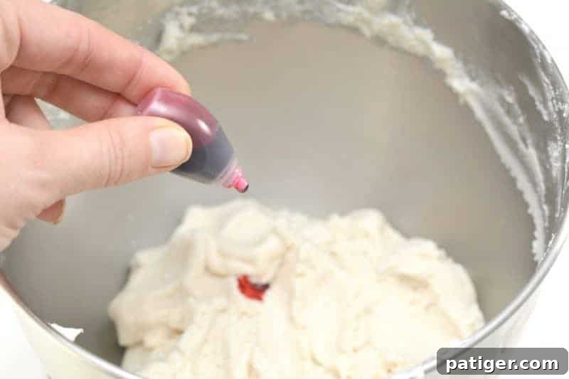 Pink Princess Sweet Dough Magic 7 Adding olive oil to the cake mix and icing mixture in a stand mixer to adjust consistency.