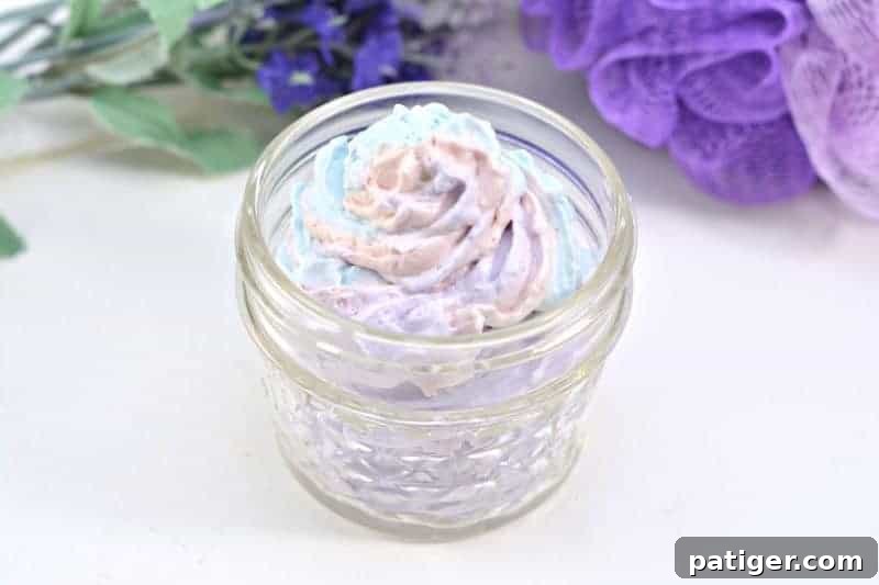 An easy DIY unicorn whipped body butter recipe made using shea butter, coconut oil, mica powder, and essential oils. Not only is this rainbow unicorn body butter beautiful, but this homemade body butter is rich, creamy, and moisturizing as well.