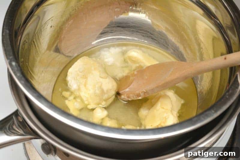 An easy DIY recipe for a magical unicorn whipped body butter made using shea butter, coconut oil, mica powder, and essential oils. In addition to being beautiful, this rainbow unicorn homemade body butter is rich, creamy, and moisturizing as well.