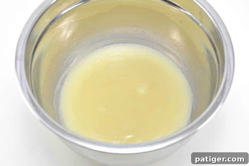 An easy DIY recipe for a magical unicorn whipped body butter made using shea butter, coconut oil, mica powder, and essential oils. In addition to being beautiful, this rainbow unicorn homemade body butter is rich, creamy, and moisturizing as well.