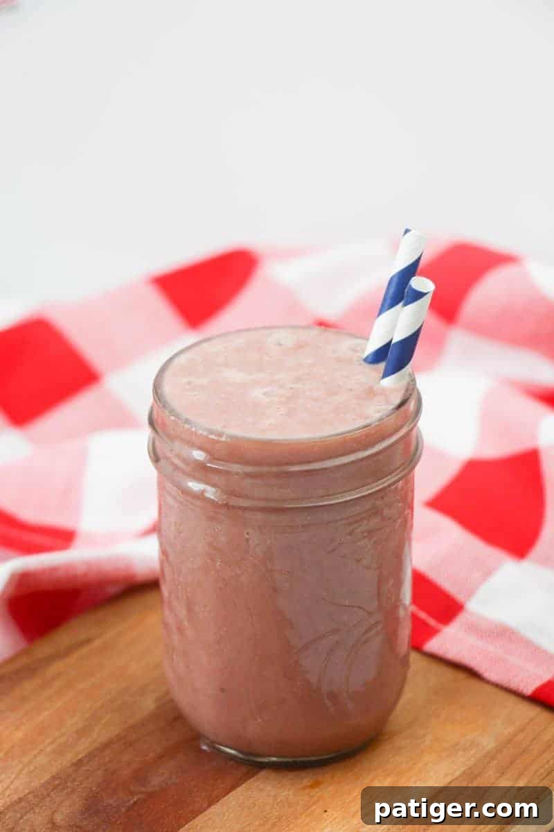 Delicious pineapple cherry smoothie recipe made with frozen pineapple, cherries, kale, almond milk, yogurt, and vanilla extract. A tasty and refreshing treat for kids or grown-ups!