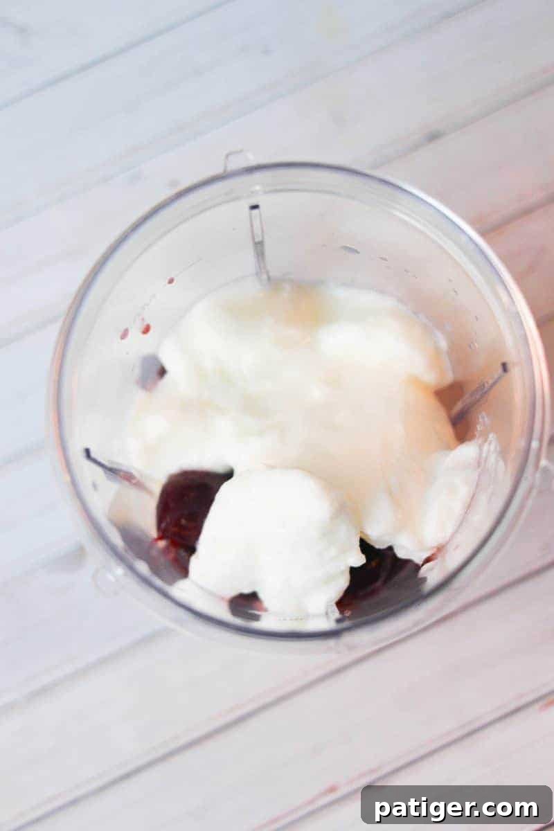 Delicious pineapple cherry smoothie recipe made with frozen pineapple, cherries, kale, almond milk, yogurt, and vanilla extract. A tasty and refreshing treat for kids or grown-ups!