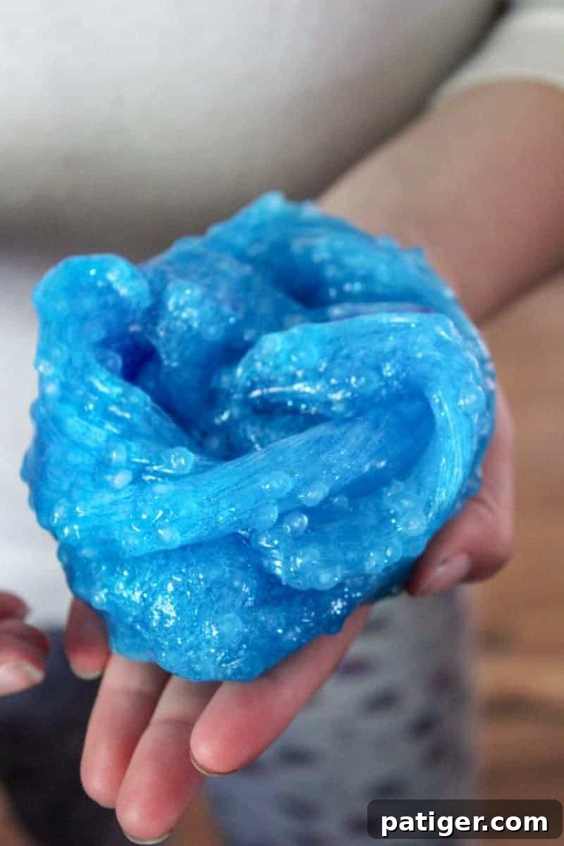 Finished borax-free ocean slime with toy fish, beautifully textured and ready for sensory play.