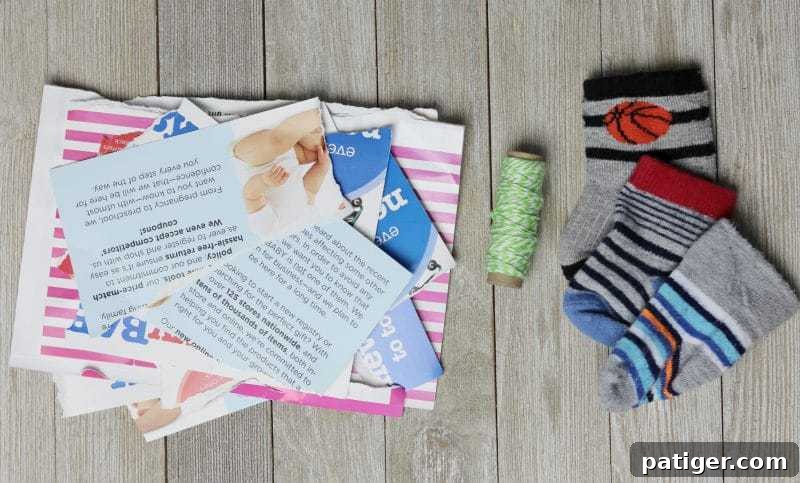 Essential supplies for crafting DIY cat toys: baby socks, paper, string, scissors.