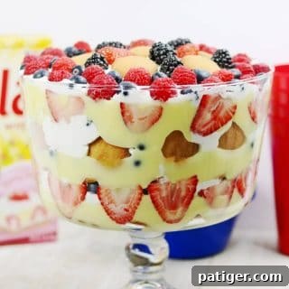 A red, white, and blue patriotic berry trifle recipe made with fresh berries, Nilla Wafers, vanilla pudding, and frozen whipped topping. This easy trifle recipe makes a great no-bake summer dessert and is perfect for patriotic holidays such as Memorial Day, 4th of July, and Flag Day.