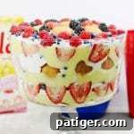 A red, white, and blue patriotic berry trifle recipe made with fresh berries, Nilla Wafers, vanilla pudding, and frozen whipped topping. This easy trifle recipe makes a great no-bake summer dessert and is perfect for patriotic holidays such as Memorial Day, 4th of July, and Flag Day.