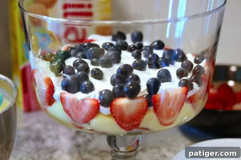 Stars and Stripes Berry Trifle 7 Layers of whipped topping and fresh blueberries and strawberries in a Patriotic Berry Trifle.