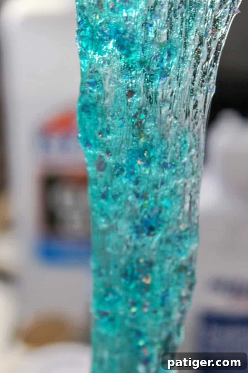 Sticky slime starting to form after adding saline solution.