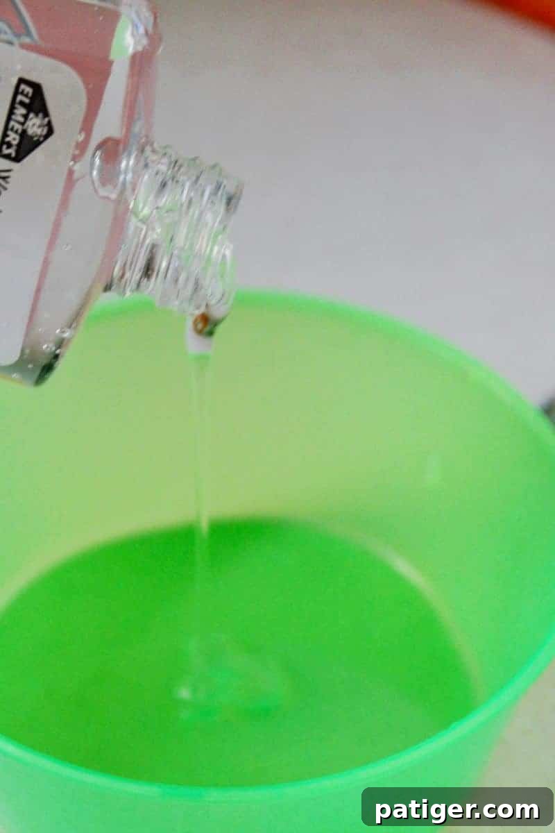 Step 2: Adding clear glue to water and baking soda for mermaid slime.